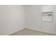 Bright bedroom with carpeted floor and window coverings at 1615 S 239Th Dr, Buckeye, AZ 85326