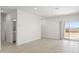 Bright dining room with tile floors and sliding glass doors to backyard at 1615 S 239Th Dr, Buckeye, AZ 85326