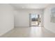 Bright dining room with tile floors and sliding glass doors to backyard at 1615 S 239Th Dr, Buckeye, AZ 85326