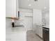 Modern kitchen with white cabinets, stainless steel appliances, and an island at 1615 S 239Th Dr, Buckeye, AZ 85326