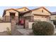 Home exterior featuring a courtyard entry with an iron gate at 16711 S 178Th Dr, Goodyear, AZ 85338