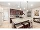 Spacious kitchen with granite island and dark wood cabinets at 16711 S 178Th Dr, Goodyear, AZ 85338