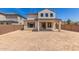 Two-story house with a covered patio and a large backyard at 1702 W Flintlock Dr, San Tan Valley, AZ 85144