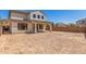 Two-story house with covered patio and large backyard at 1702 W Flintlock Dr, San Tan Valley, AZ 85144