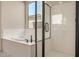 Bathroom with walk-in shower and large window, great natural light at 1702 W Flintlock Dr, San Tan Valley, AZ 85144
