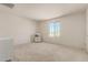 Simple bedroom with carpet and a bookshelf at 1702 W Flintlock Dr, San Tan Valley, AZ 85144