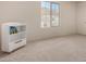 Bright bedroom with a bookshelf and window at 1702 W Flintlock Dr, San Tan Valley, AZ 85144