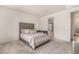 Spacious bedroom with ensuite bathroom and a view of the bathroom at 1702 W Flintlock Dr, San Tan Valley, AZ 85144