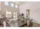 Dining area with a large table, hardwood floors, and access to the living room at 1702 W Flintlock Dr, San Tan Valley, AZ 85144