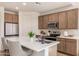 Modern kitchen with stainless steel appliances and an island at 1702 W Flintlock Dr, San Tan Valley, AZ 85144