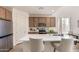 Modern kitchen with stainless steel appliances and an island at 1702 W Flintlock Dr, San Tan Valley, AZ 85144