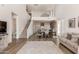 Two story living room with an open floor plan, staircase, and loft at 1702 W Flintlock Dr, San Tan Valley, AZ 85144