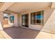 Covered patio with sliding glass doors leading to the backyard at 1702 W Flintlock Dr, San Tan Valley, AZ 85144