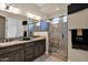 Elegant bathroom with double vanity and glass shower enclosure at 1713 E Amaranth Trl, Queen Creek, AZ 85140