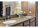 Double vanity bathroom with granite countertops and modern fixtures at 1713 E Amaranth Trl, Queen Creek, AZ 85140