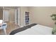 Bedroom with twin beds, built in shelving and natural light at 1713 E Amaranth Trl, Queen Creek, AZ 85140