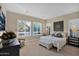 Main bedroom with large windows and neutral decor at 1713 E Amaranth Trl, Queen Creek, AZ 85140