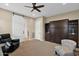 Bedroom with built-in murphy bed and ceiling fan at 1713 E Amaranth Trl, Queen Creek, AZ 85140