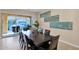 Bright dining room with sliding glass doors leading to the patio at 1713 E Amaranth Trl, Queen Creek, AZ 85140