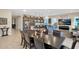 Spacious dining room with large table and access to backyard patio at 1713 E Amaranth Trl, Queen Creek, AZ 85140