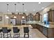 Modern kitchen with granite island and stainless steel appliances at 1713 E Amaranth Trl, Queen Creek, AZ 85140