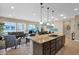 Open concept kitchen with island and dark wood cabinetry at 1713 E Amaranth Trl, Queen Creek, AZ 85140