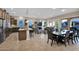 Spacious kitchen with an island, dark wood cabinetry, and breakfast bar at 1713 E Amaranth Trl, Queen Creek, AZ 85140