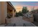 Backyard patio with water feature and lounge chairs at 1713 E Amaranth Trl, Queen Creek, AZ 85140