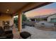 Covered patio with fireplace, seating area, and water feature at 1713 E Amaranth Trl, Queen Creek, AZ 85140
