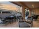 Spacious patio with dining furniture and a water feature at 1713 E Amaranth Trl, Queen Creek, AZ 85140