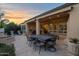 Large patio with dining area and access to the interior at 1713 E Amaranth Trl, Queen Creek, AZ 85140