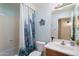 Clean bathroom with a cactus-themed shower curtain at 18431 N Coconino Dr, Surprise, AZ 85374