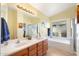 Bathroom with double vanity, large mirror, and soaking tub at 18431 N Coconino Dr, Surprise, AZ 85374