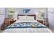 Bedroom with a queen bed, two nightstands, and rocking chairs at 18431 N Coconino Dr, Surprise, AZ 85374