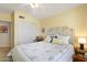 Bedroom with a queen bed, ceiling fan, and double door closet at 18431 N Coconino Dr, Surprise, AZ 85374