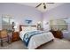 Spacious bedroom with wooden furniture and large windows at 18431 N Coconino Dr, Surprise, AZ 85374