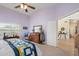 Bedroom with a view into another room, dresser, and rocking chair at 18431 N Coconino Dr, Surprise, AZ 85374