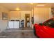 Garage with car, storage cabinets, and laundry area at 18431 N Coconino Dr, Surprise, AZ 85374