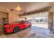 Garage with car, bikes, and storage cabinets at 18431 N Coconino Dr, Surprise, AZ 85374