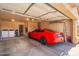 Garage with car, washer, dryer, and storage at 18431 N Coconino Dr, Surprise, AZ 85374