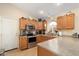 Kitchen features stainless steel appliances and ample wood cabinets at 18431 N Coconino Dr, Surprise, AZ 85374