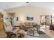 Comfortable living room with leather furniture and patio access at 18431 N Coconino Dr, Surprise, AZ 85374