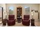 Relaxing living room with two recliners and a bookcase at 18431 N Coconino Dr, Surprise, AZ 85374