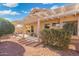 Backyard patio with pergola, landscaping, and seating area at 18431 N Coconino Dr, Surprise, AZ 85374