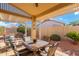 Covered patio with seating area and desert landscaping at 18431 N Coconino Dr, Surprise, AZ 85374
