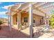 Spacious backyard patio with pergola, seating, and hot tub at 18431 N Coconino Dr, Surprise, AZ 85374