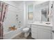 Clean bathroom with tub, toilet, and modern vanity at 18956 W Laurel Ln, Surprise, AZ 85388