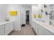 Elegant bathroom with double vanity, large mirror, and walk-in shower at 18956 W Laurel Ln, Surprise, AZ 85388