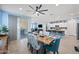 Open concept dining room with view into kitchen and living areas at 18956 W Laurel Ln, Surprise, AZ 85388