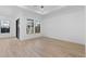 Bright bedroom features tile floors, large windows, and a modern ceiling fan at 20316 W Turney Ave, Buckeye, AZ 85396